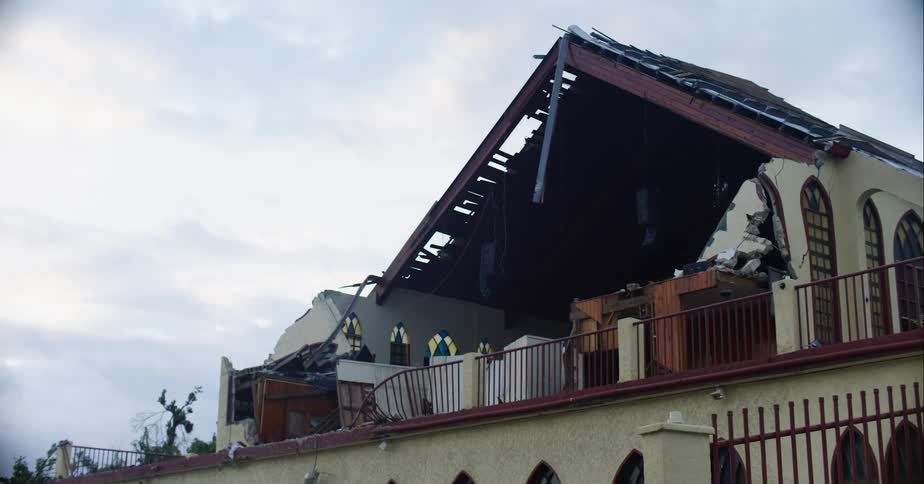 Church building missing front and roof in tornado aftermath