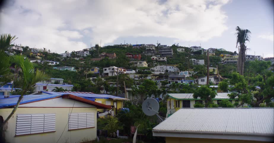 Clouds pass over town covering valley and top of hills