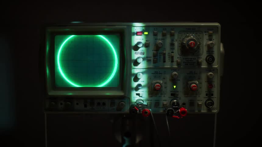 The oscilloscope is flashing in the dark room