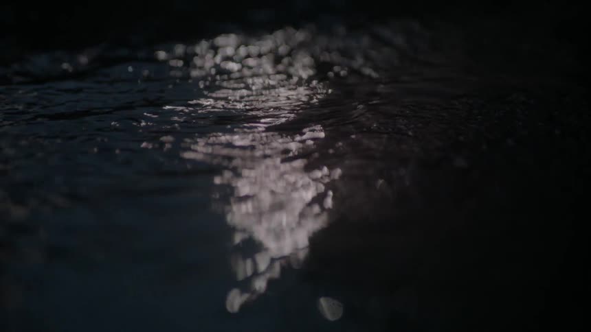 Water flowing in the dark