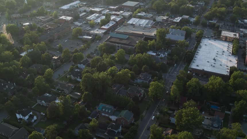 Aerial view of a town with many trees and houses