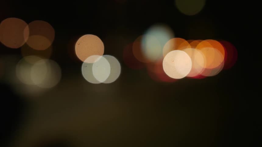 Blurry shot of cars driving on a road at night