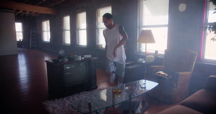 A young man dancing at home