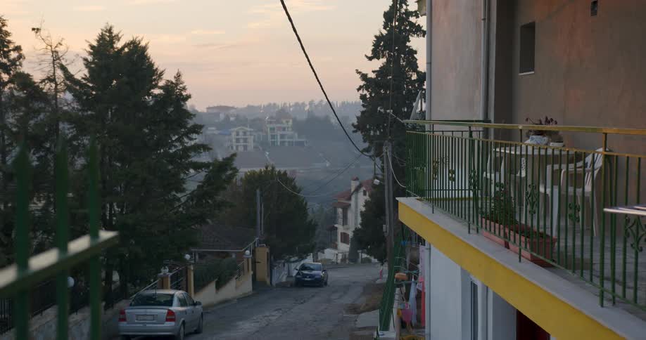 A neighborhood street with cars parked on it