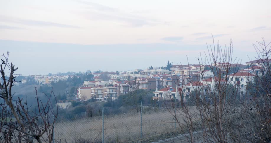 Houses on hillside in small town