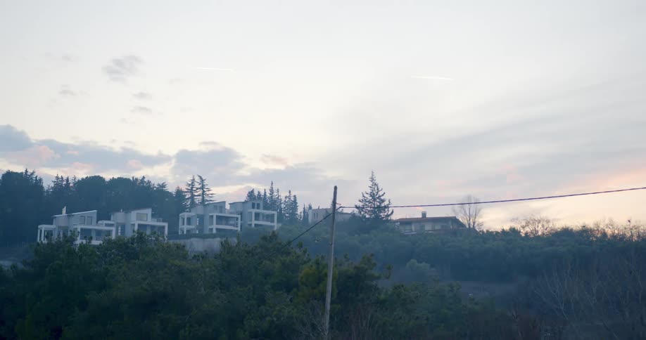 Modern style homes on hillside at dawn