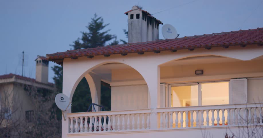 The balcony of a building in the evening