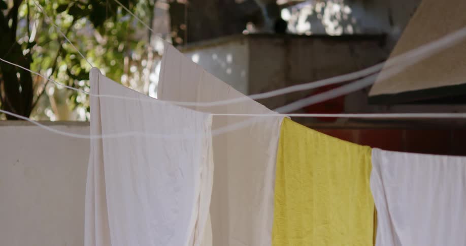 Sheets hanging on outdoor clothesline