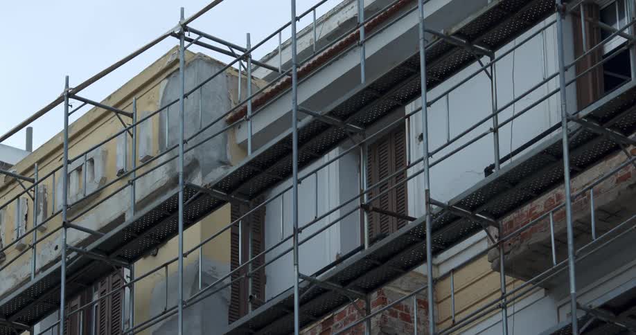 A scaffolding is outside the building