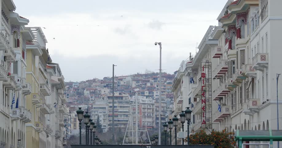 Buildings are packed on hill overlooking apartment buildings