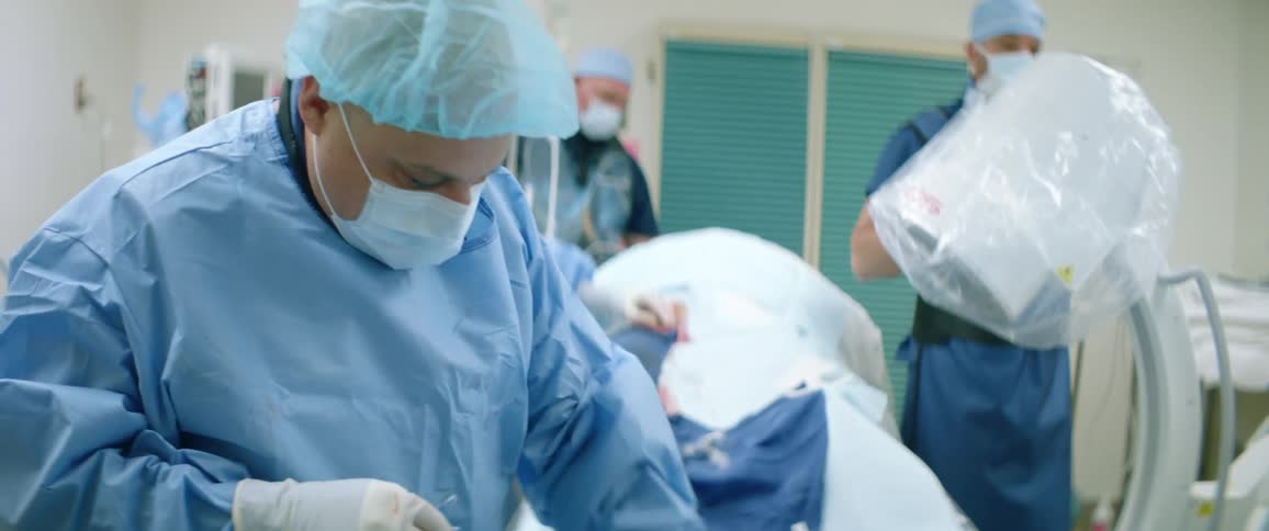 A group of doctors and medical staff prepare medical equipment in the hospital