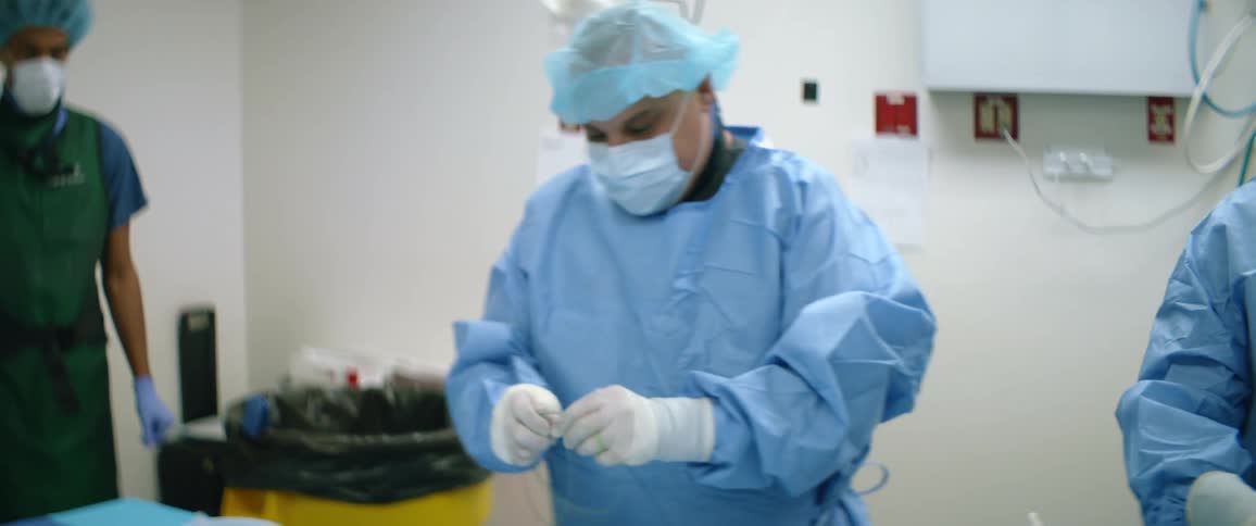 A medical prepares their process in a hospital