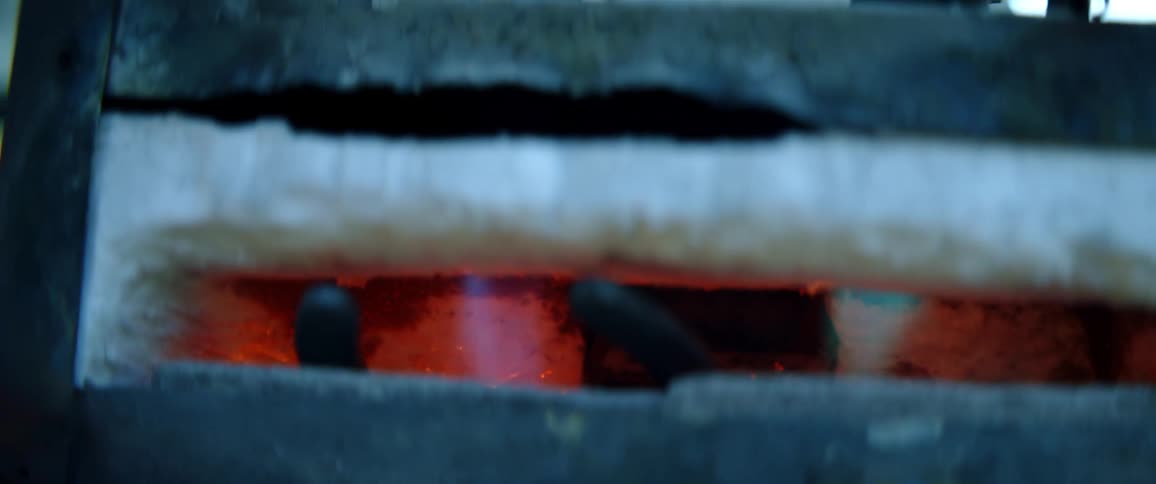 An outdoor stove with blue fire and flames