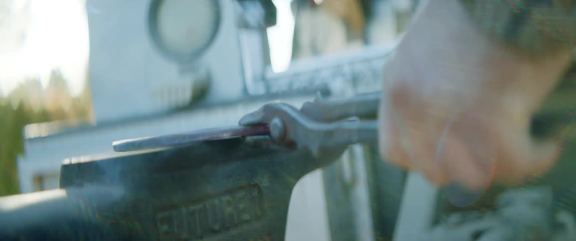 A man hammers on a horseshoe