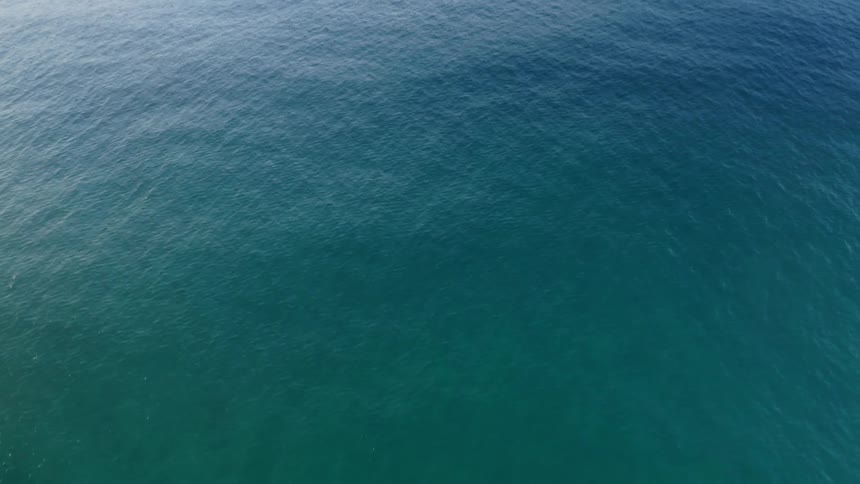 The open blue green ocean on a sunny day