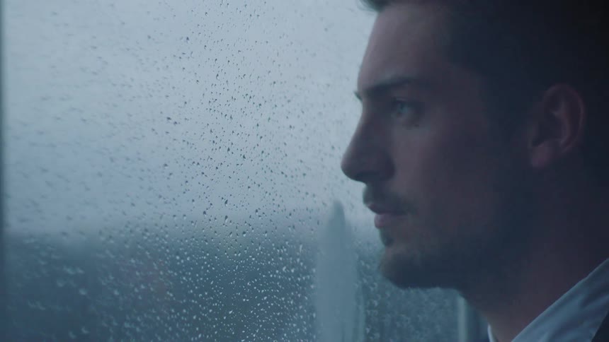 A man standing in an office thinking