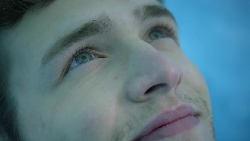 A young man looking up at the sky