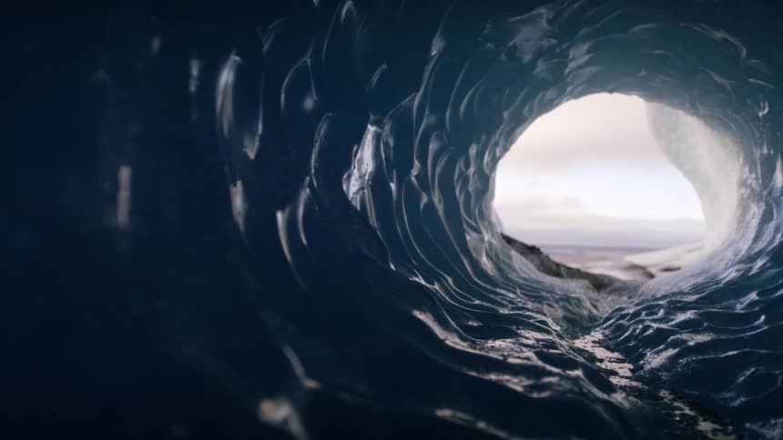 A large textured tube is made to look like the ocean and shows views of the ocean