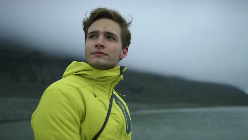 A man on a boat looks around