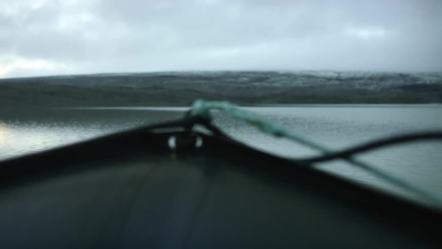 A boat that is floating on a lake