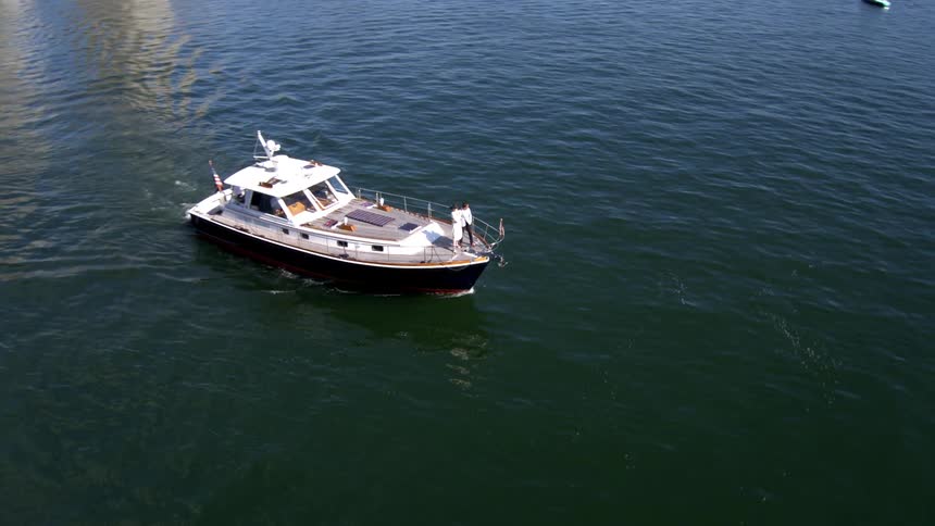 A boat is driving through the ocean