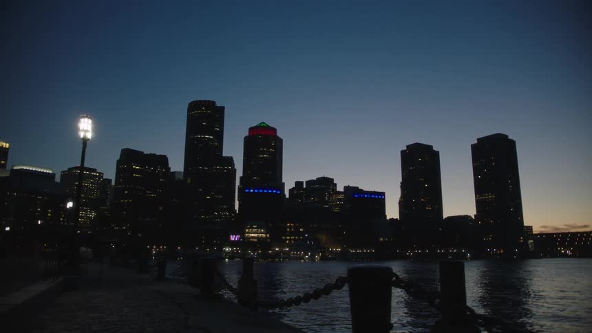 A city near the coast with buildings with the sky and clouds in the background