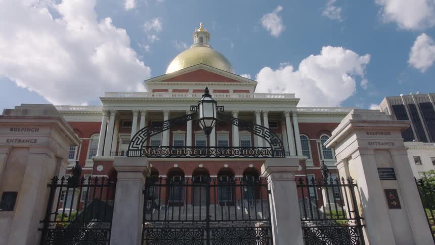 Clouds floating above a domed government building on a summer day