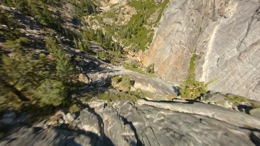 An aerial view of trees and mountains in the wilderness