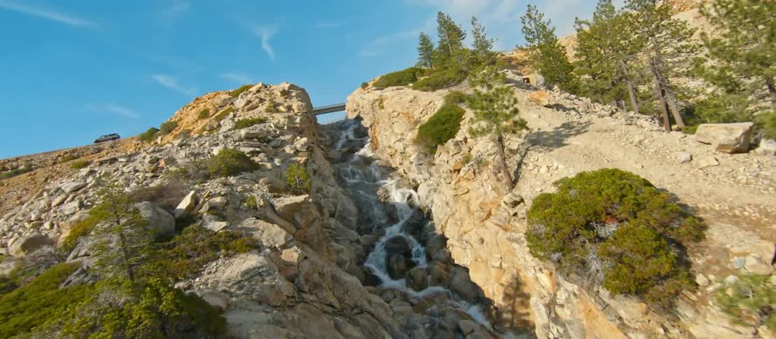 A river flowing through a rocky canyon in the wilderness on a summer day