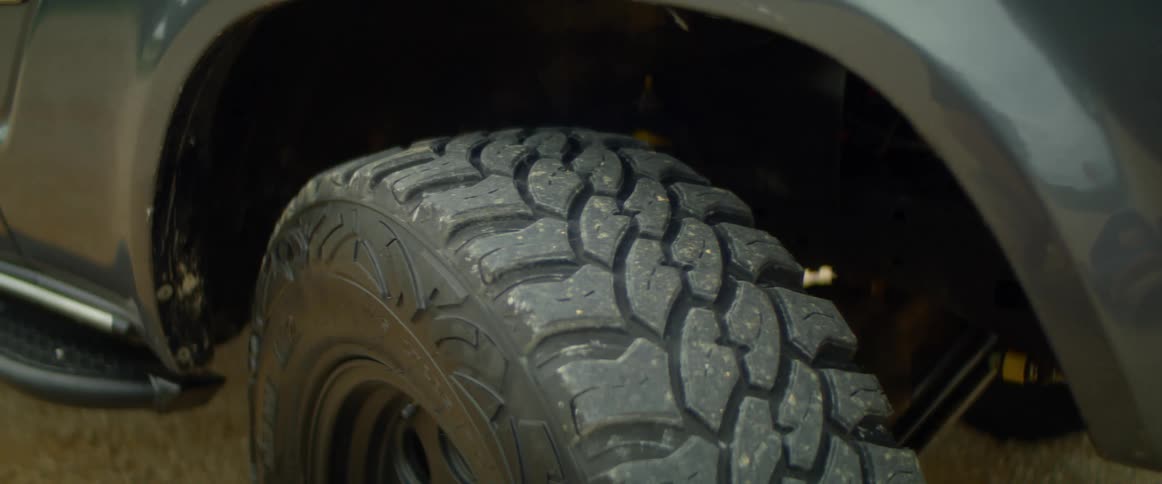 Tire with deep tread on truck