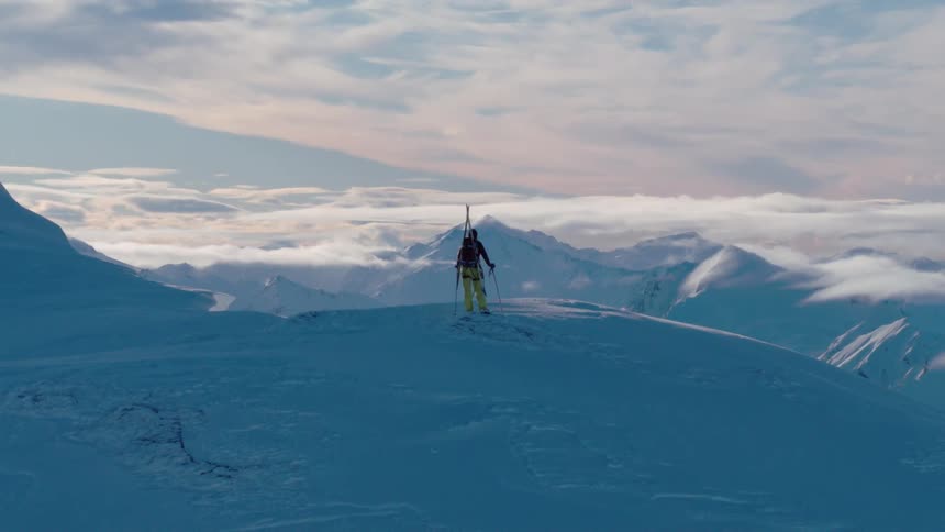 A person is skiing in the mountains