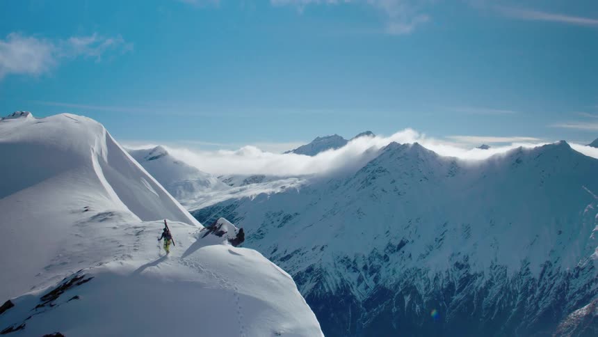 A person is walking on the mountain top
