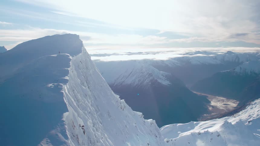 Snow covered mountains and deep canyon with dry riverbed