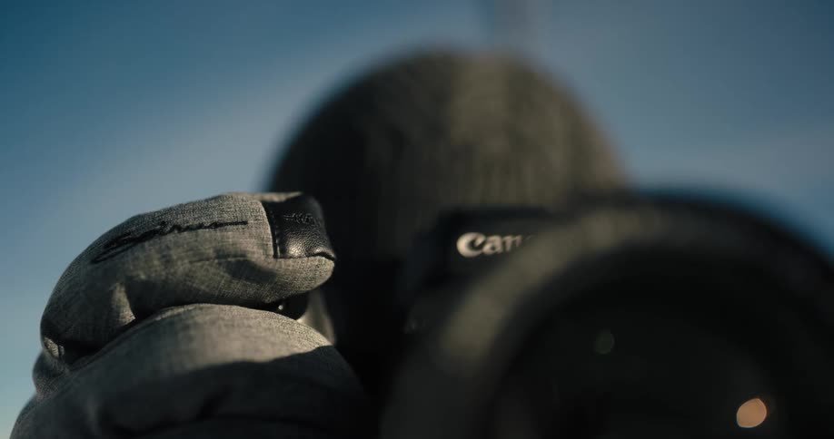 A photographer taking pictures outside