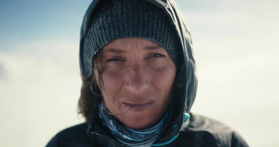 A woman is standing outdoors in the arctic