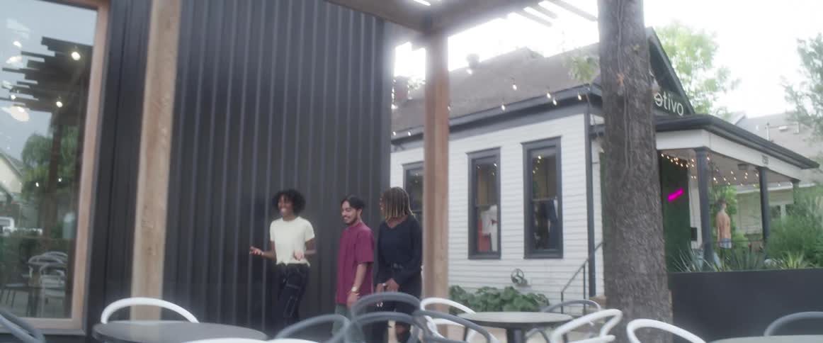Group of friends walk around the shopping district on a small town