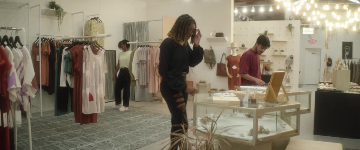 Friends shopping in clothing boutique