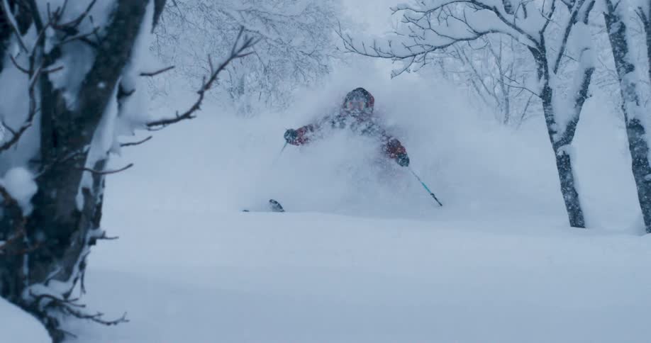 A person is skiing outdoors in the winter