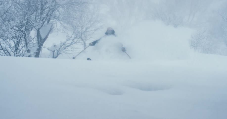 A person is skiing in the snow during the day