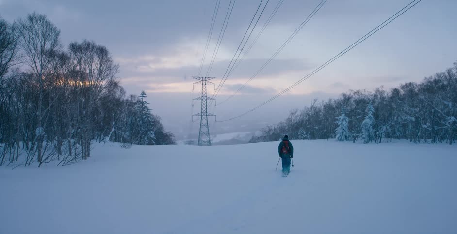 A person skis over the snow