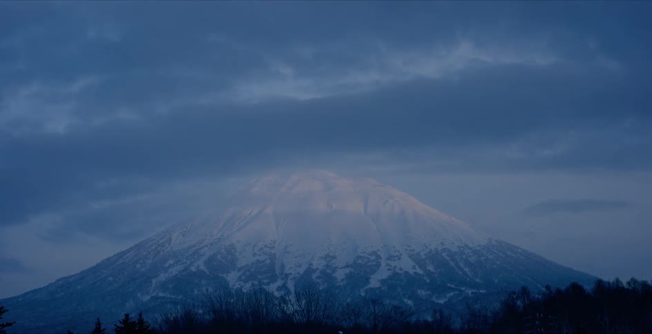Aerial view of mountains in winter is displayed