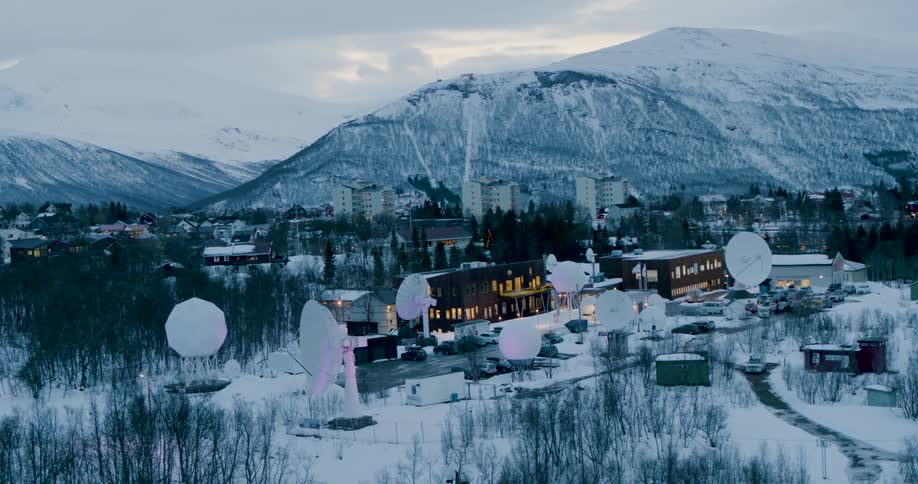A satellite technology center sits at the base of a mountain in Norway