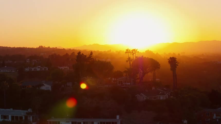 The sun shines brightly and goes down on the horizon