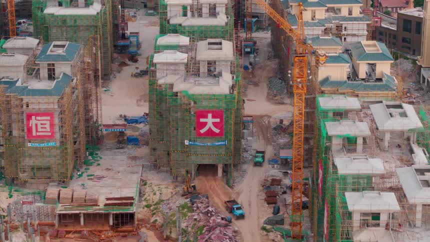 Trucks driving on a dirt road in a construction site in China