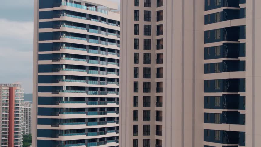 A pair of skyscrapers in a metropolis on a sunny day