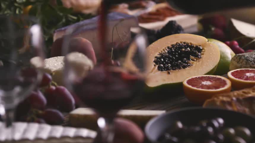 Wine is served on a table full of food