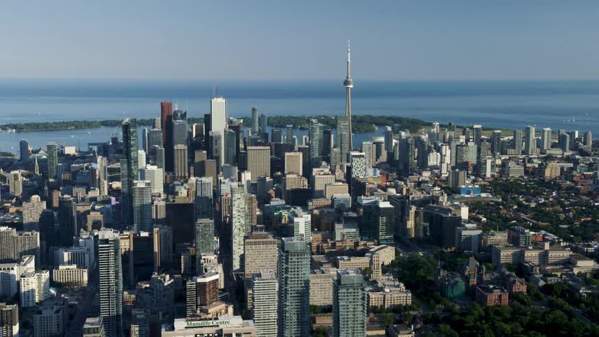 Aerial of a city scape featuring downtown Toronto's CN Tower