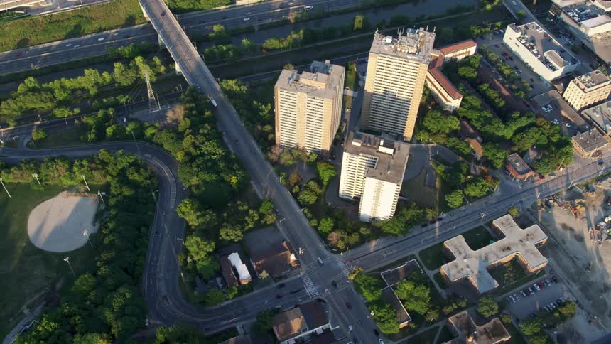 An aerial view of buildings and paved streets in a city