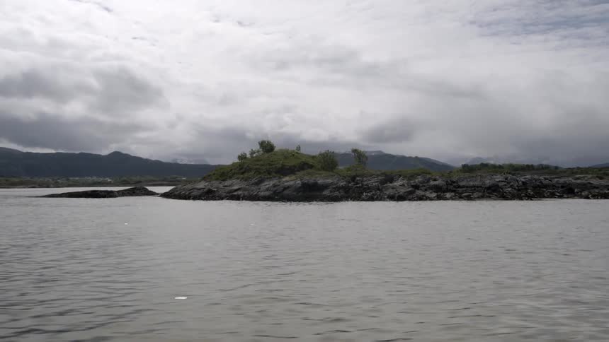 A rocky island on a cloudy day