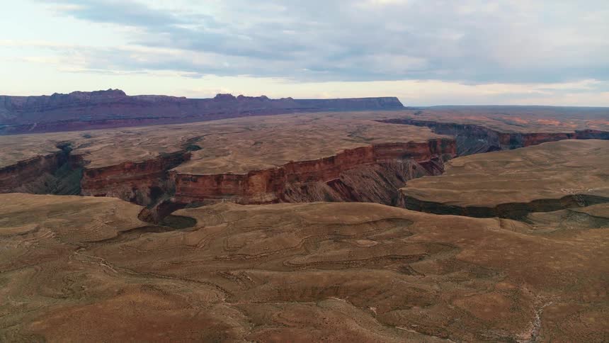 Aerial view of a valley at dusk is displayed